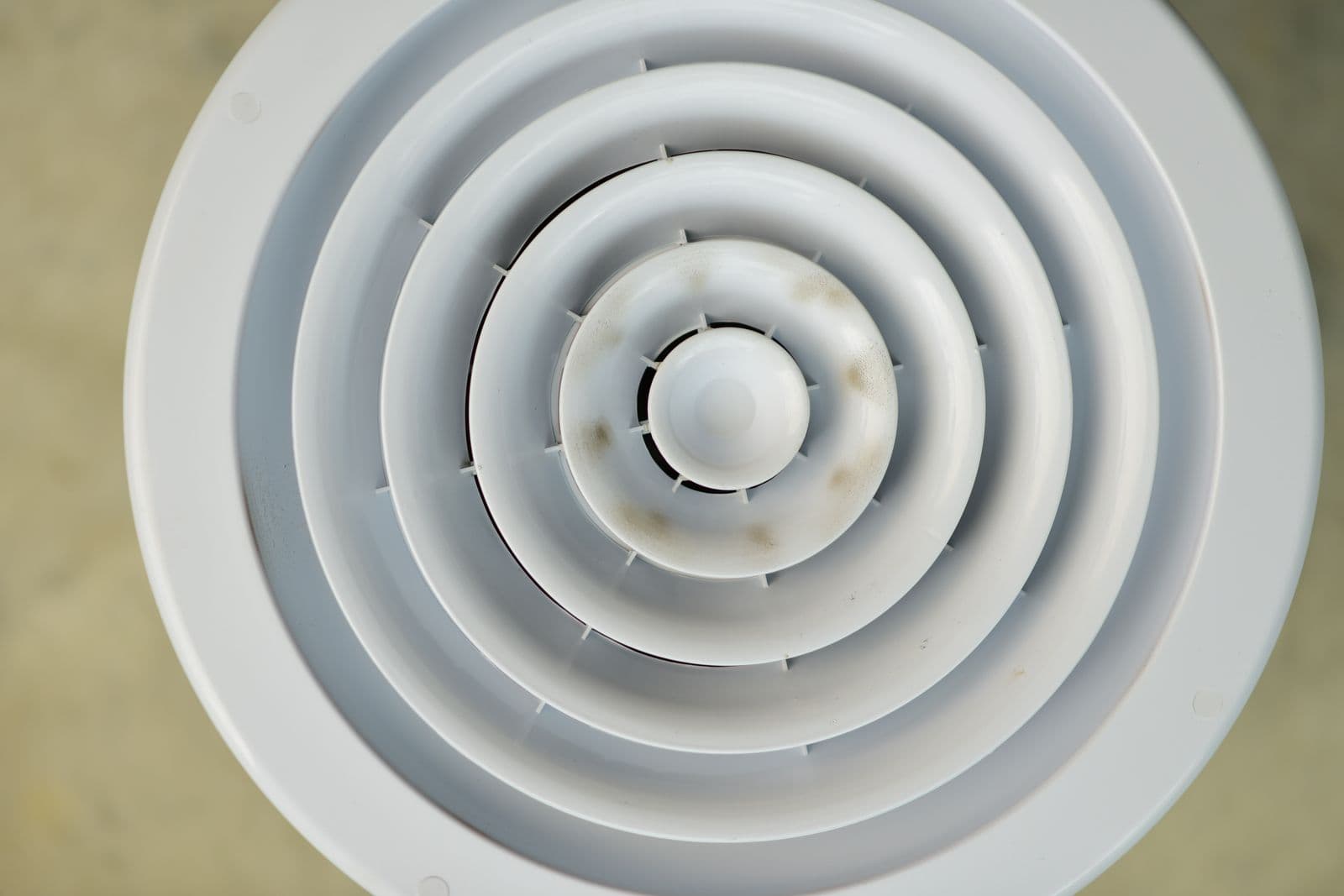 A round residential ceiling air vent of the kind cleaned during professional air duct cleaning